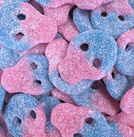 Close-up of pink and blue gummy bears with a glittery texture.